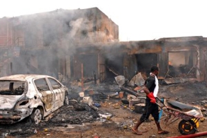 Wreckage of burnt vehicle after blasts at Terminus market in Jos, Nigeria